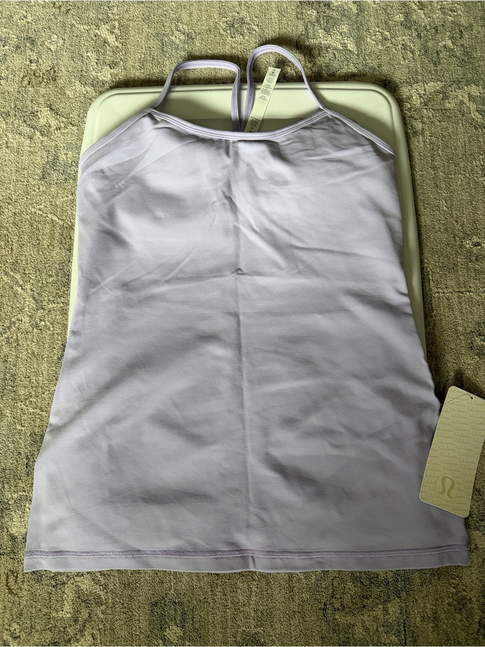 Women’s Lululemon Power Y tank
Size 10
Color light purple. 
NWT